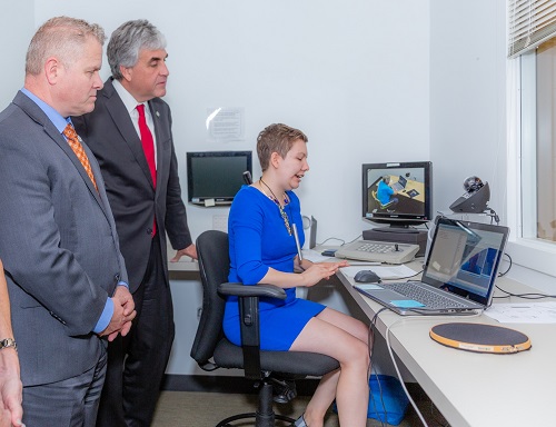 Graduate student Kate Witham demonstrates technologies to ACL Administrator Lance Robertson and HHS Deputy Secretary Eric Hargan.