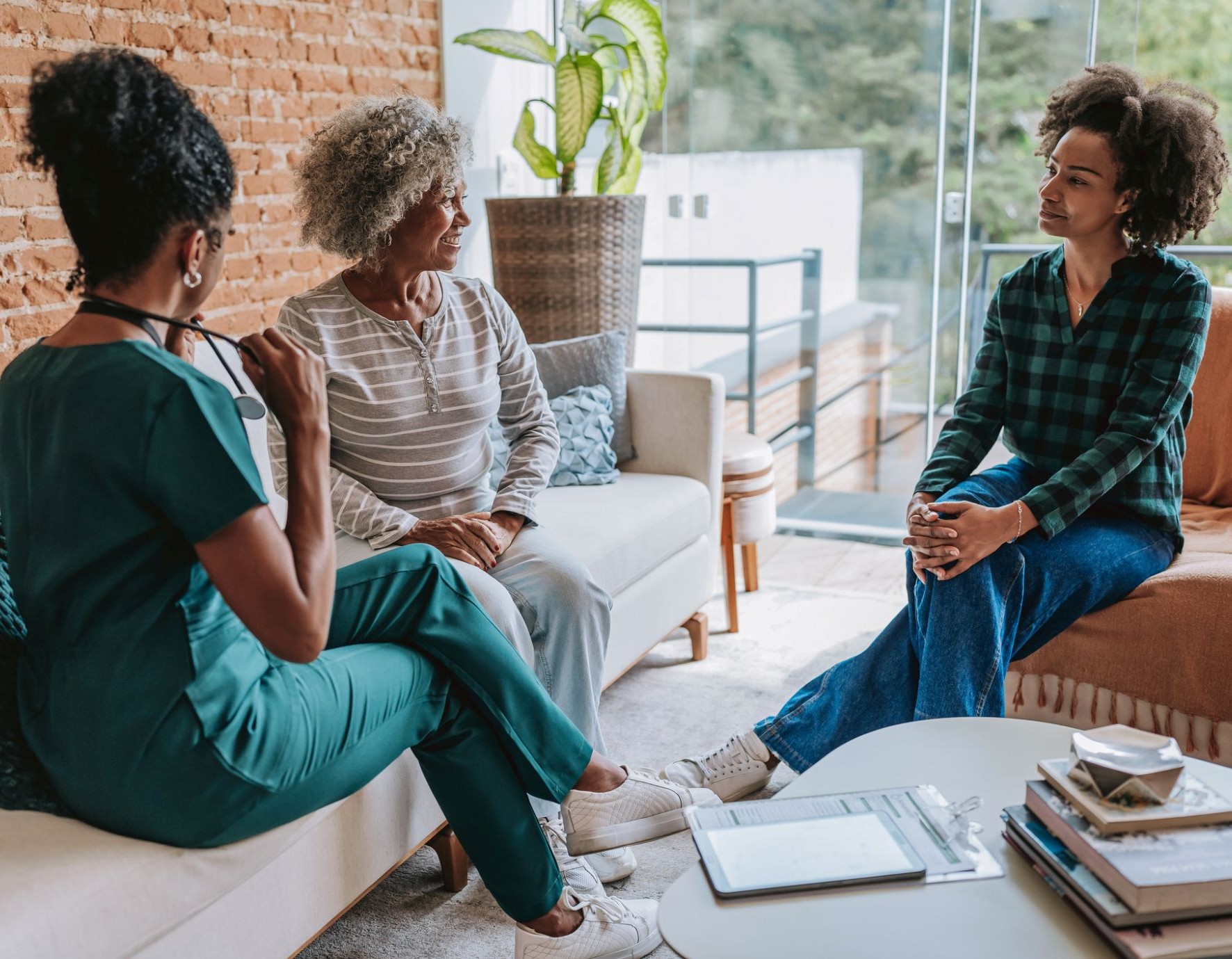 3 women sitting together talking