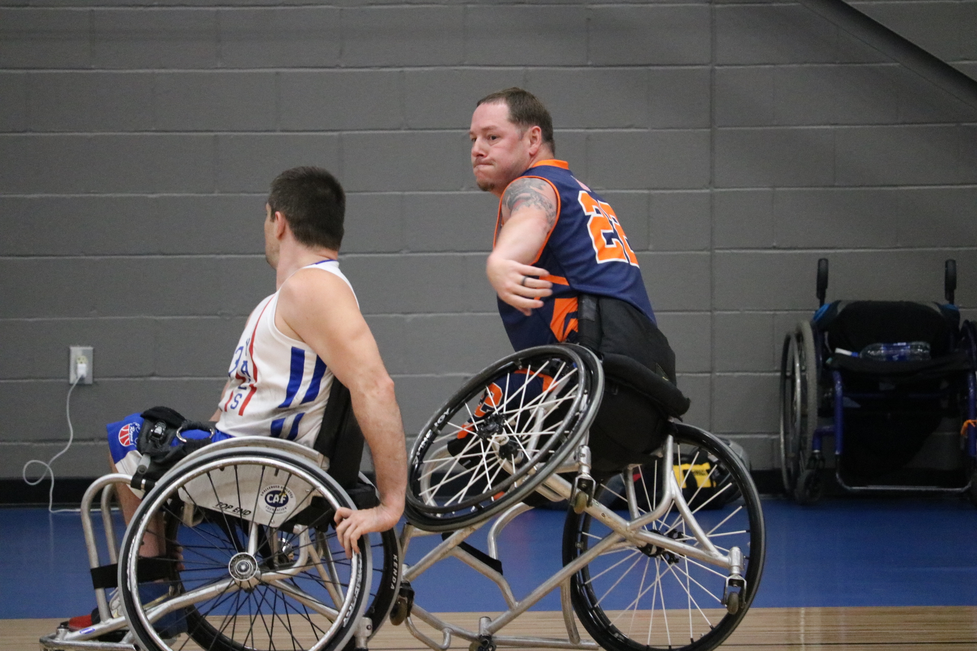 Two men playing wheelchair basketball