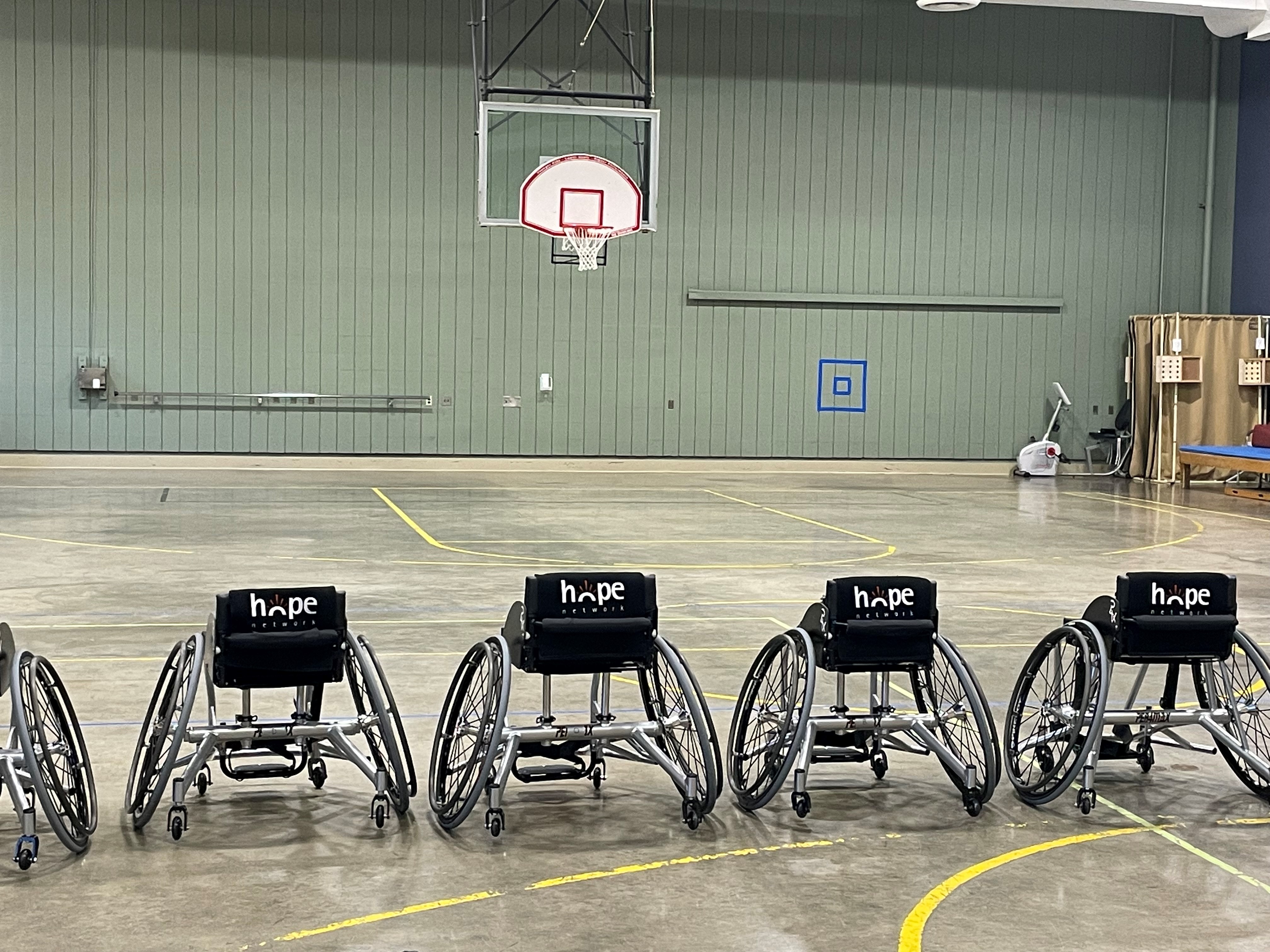 Photo of basketball wheelchairs on the court