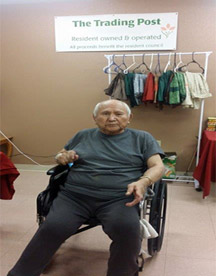 A resident in a wheelchair at the Trading Post